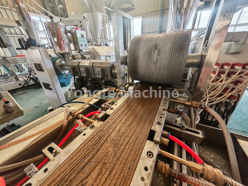 Yongte WPC decking co-extrusion line with online 3D embossing equipment is tested successfully